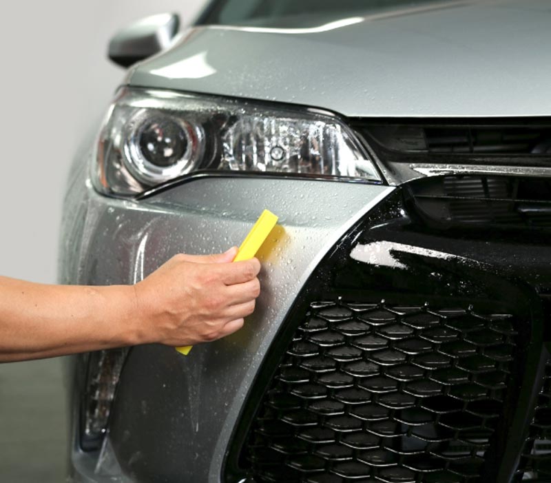 silver car with great paint job being washed